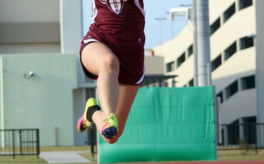 Matthew C. Perry's Kaitlyn Flynn leaps to victory in the long jump during Saturday's Samurai Invitational.