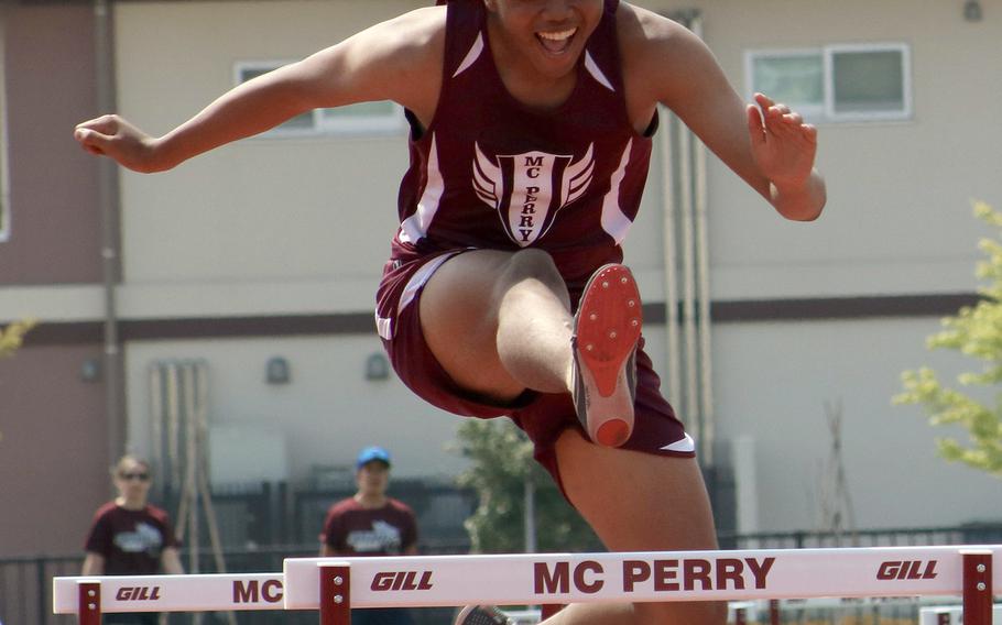 Shawn Swindell leaps en route to victory in the 300 hurdles during Saturday's Samurai Invitational.