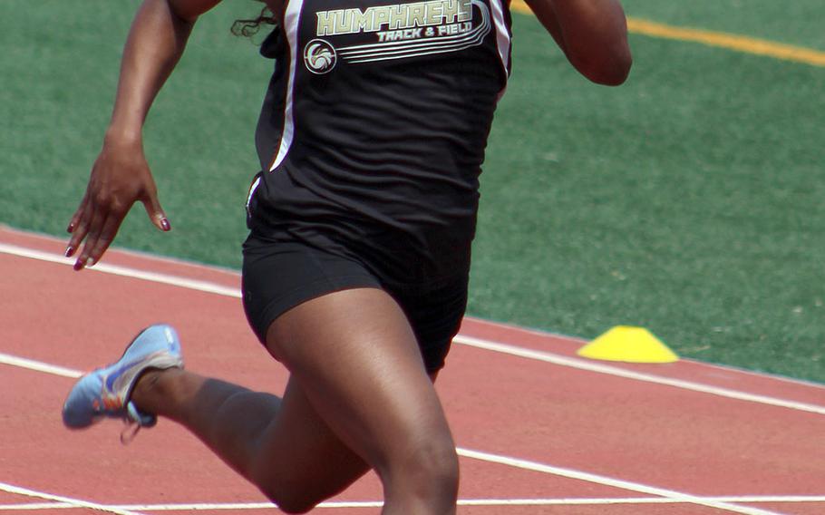 Humphreys' Jaela Higgs makes her way down the stretch during Saturday's Korea district track and field finals. Higgs won the 100, 200 and 400.
