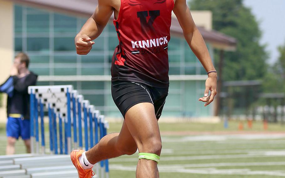 Nile C. Kinnck junior speedster Chris Watson crosses the finish line first in the 400-meter dash during Saturday's Kanto Plain track and field finals. Watson won the 100, 200 and 400 and is currently leading the Pacific in the 100.