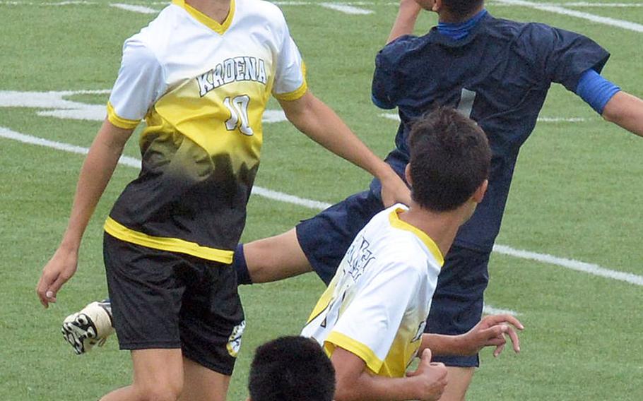 Kadena's Kian Smith heads the ball against Nanbu Shogyo during Saturday's Okinawa boys soccer match, won by the Panthers 3-1.