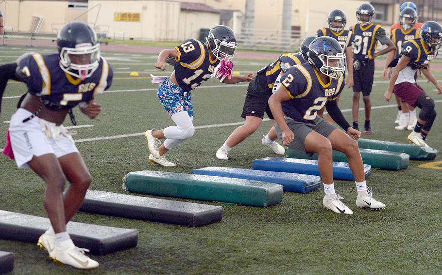 Guam High players go through agility drills during a three-day combine at Yokota.