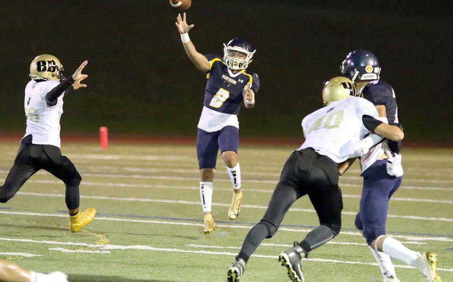 Guam High quarterback Travon Jacobs unleashes a pass against the Tiyan defense.