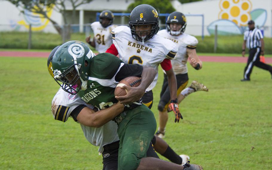 Jaylan Mayers, a player for the Kubasaki Dragons, runs the ball during a game against the Kadena Panthers at Mike Petty Stadium on Camp Foster, Okinawa, Japan, Saturday, Sept. 7, 2019. 