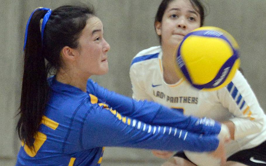 Yokota senior Emily Taynton digs the ball during Tuesday's Kanto Plain girls volleyball match, won by Christian Academy Japan in four sets. 