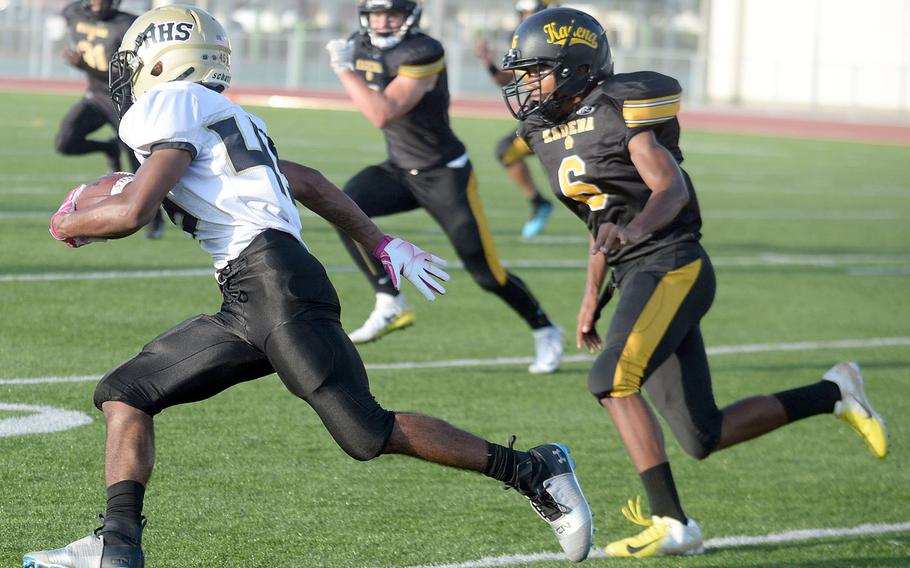 Humphreys receiver Junior Gregory looks for separation from Kadena defender Marques McDonald.