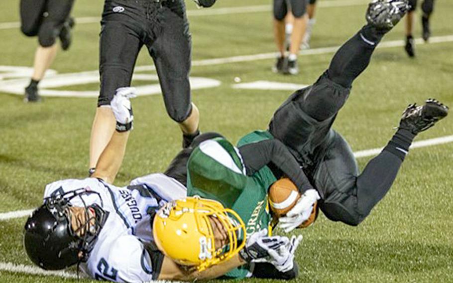 Robert D. Edgren's Joshua Figuracion is brought down by Osan's Marcus Inthaxivay.
