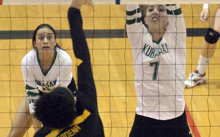 Kadena's Kyleigh Wright tries to hit the ball past Sophie Baumbach of Kubasaki during Thursday's Okinawa girls volleyball match, won by the Dragons in three sets. Kubasaki swept the season series 4-0 from Kadena and won its 16th straight district championship.