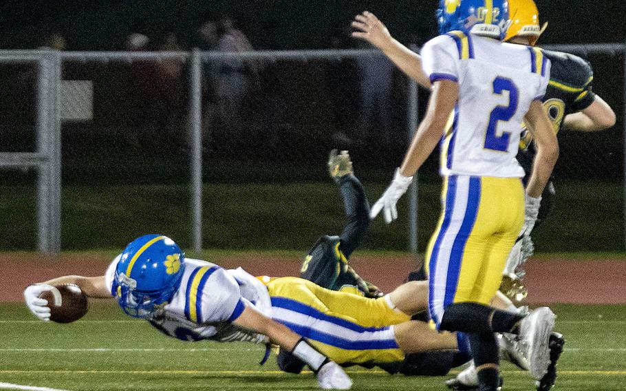 Yokota running back Ethan Smith stretches out to reach the end zone.