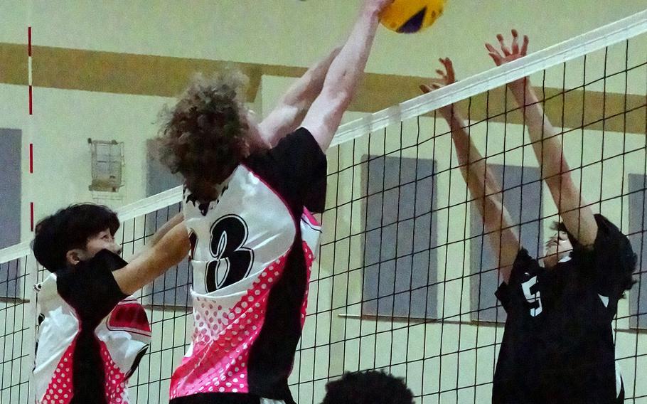 Osan's Alexander Eaglin blocks a shot by Humphreys' Luke Han during Wednesday's Korea boys volleyball match won by the Blackhawks in four sets.