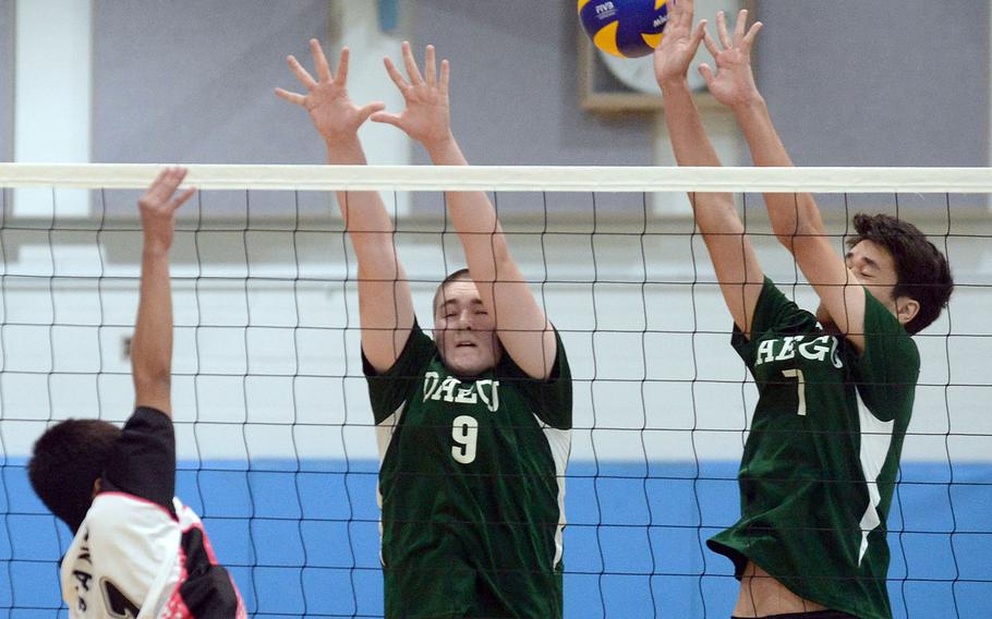 Osan's Jade Gante hits against Daegu's Chase Lamar and Angus Delaney during Saturday's Korea boys volleyball match. The Warriors won in straight sets.