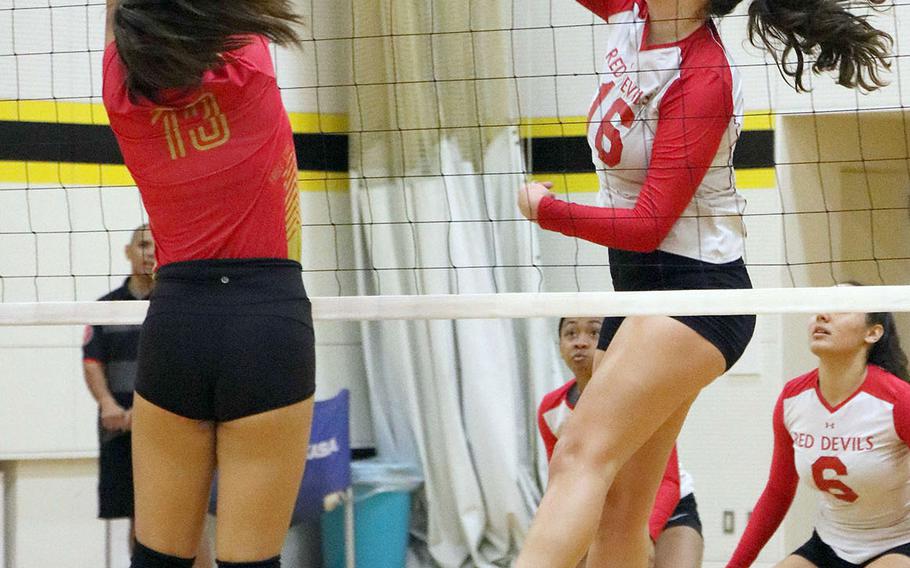 Nile C. Kinnick's Madelyn Gallo drills a spike against Shanghai American Puxi during Thursday's pool-play match in the 5th America School In Japan YUJO Volleyball Tournament. The Eagles won in two sets.