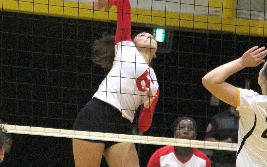 Nile C. Kinnick's Charley "Anela" Lau readies a spike against American School In Japan 2 during Thursday's pool-play match in the 5th America School In Japan YUJO Volleyball Tournament. The Red Devils won in two sets.