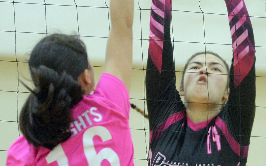 Yokota's Chloe Dozier tries to block Christian Academy Japan's Rina Seminoff during Thursday's pool-play match in the 5th American School In Japan YUJO Volleyball Tournament. The Panthers won in three sets.