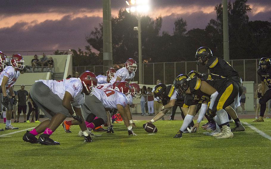 Kadena Panthers prepare to hike the ball during a game against the Nile C. Kinnick Devils at Habu Field on Kadena Air Base, Okinawa, Japan, Friday, Oct. 18, 2019. 