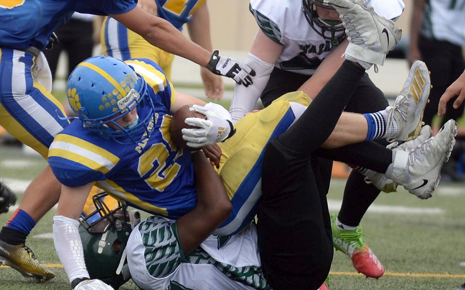 Yokota's Ethan Smith is brought down by Daegu's DeQuandre Moore.