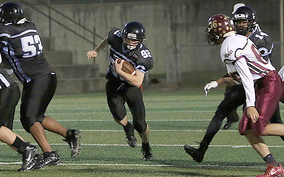 Jacob White scored the second touchdown for Osan to give the Cougars a short-lived 14-7 lead over Perry.