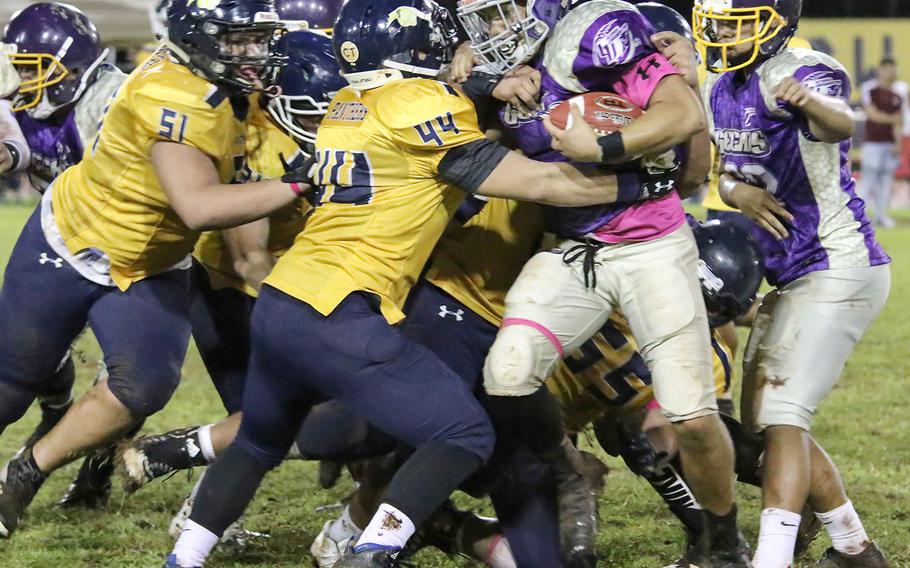 George Washington's Mykai Blas gets hemmed in by a host of Guam High defenders.