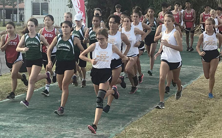 Girls dash off the start line at the beginning of Friday's Okinawa district finals at Cape Zanpa.