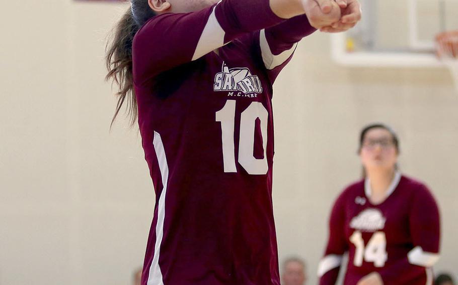 Matthew C. Perry's Grace Linville bumps the ball during Saturday's DODEA-Japan girls volleyball match against Nile C. Kinnick. The Red Devils won in three sets.