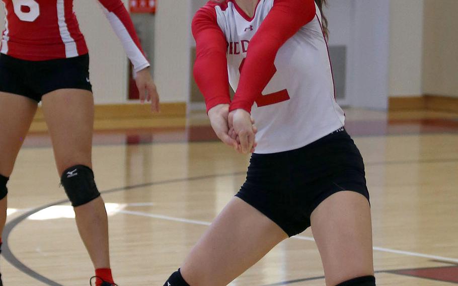Nile C. Kinnick's Kylie Martin receives serve during Saturday's DODEA-Japan girls volleyball matches. The Red Devils beat E.J. King twice and host Matthew C. Perry once, each in straight sets.