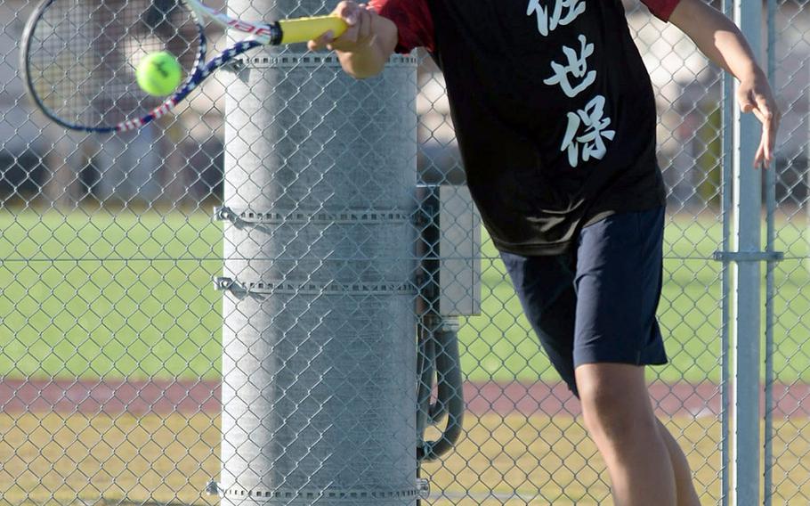 E.J. King's Kaito Bergman slaps a forehand return during Thursday's DODEA-Japan finals boys doubles match. Bergman and his partner Takumi Kodama beat Nile C. Kinnick's Daniel Posthumus and Matthew Manson 6-3.