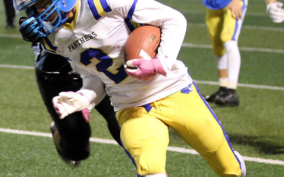 Yokota's Kura Sato gets chased down by Osan's Ramil Celones.