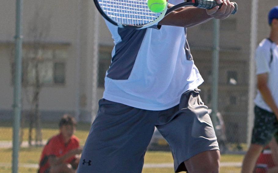Matthew C. Perry's Payton Strain hits a forehand return during Friday's DODEA-Japan tennis tournament. Strain lost his singles match 8-1 to NIle C. Kinnick's Bodhi Kuiper.
