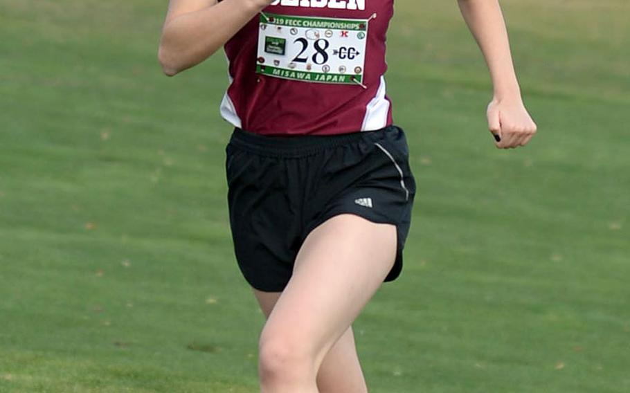 Seisen senior Nana Richter nears the finish line to win the girls Division I title in the Far East cross country race. She joins her older brother Thomas as a Far East champion; he won the boys Division I title in 2016.