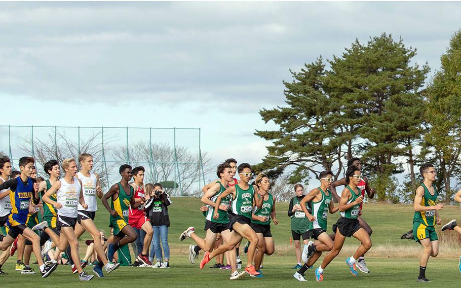 The boys field takes off from the start line, led by eventual Division I and overall winner Hanokheliyahu Gailson of Nile C. Kinnick, far right.