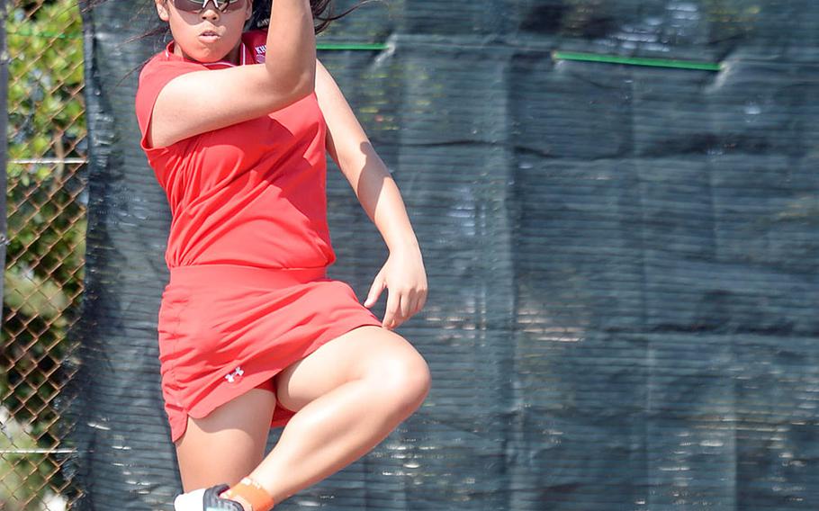 Nile C. Kinnick's Amary-Gail Perfecto hits a forehand shot against Arisa Manuel of Kubasaki during Wednesday's Far East tennis tournament girls singles action. Perfecto won 8-0.