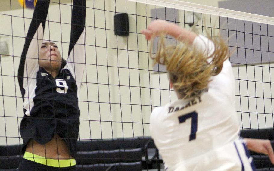 Guam High's Malia Dabney spikes past Humphreys' Natalie Goode during Thursday's Far East Division I volleyball tournament pool match. The Blackhawks won in two sets.