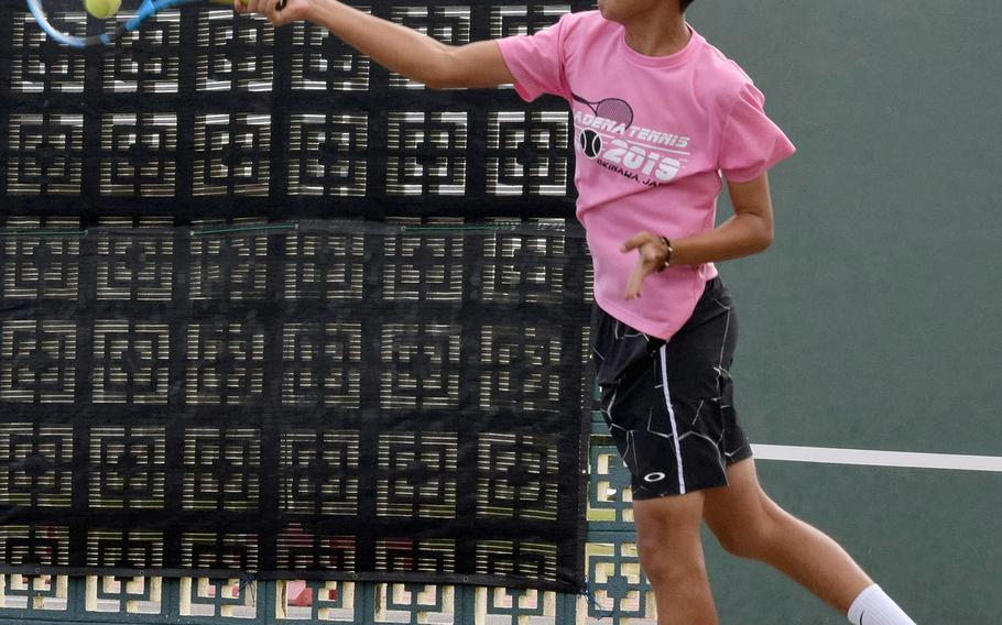 Kadena's Justin Saavedra hits a forehand smash during Thursday's Far East tennis tournament boys doubles. Saavedra and partner Matt Steele lost in the first round.