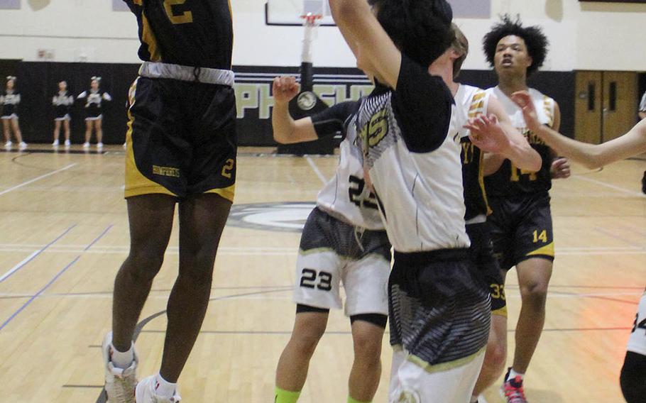 Humphreys' Myles Johnson skies for a shot against Taejon Christian.