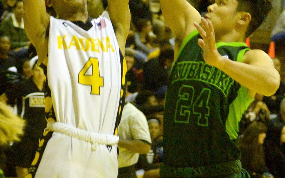 Kadena's Kai Harris shoots against Kubasaki's Kiyon Smith during Friday's Okinawa boys basketball game. The Panthers won 76-43.