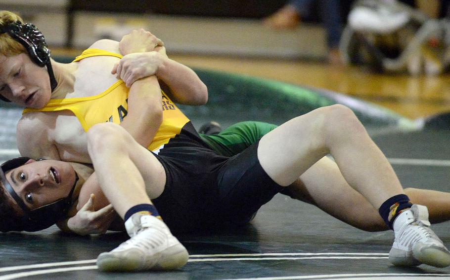 Kadena's Aiden Russell pins Kubasaki's Vincent Rodriguez in 2 minutes, 39 seconds at 115 pounds during Wednesday's Okinawa wrestling dual meet. The Dragons won 38-24 to even the season series 1-1.