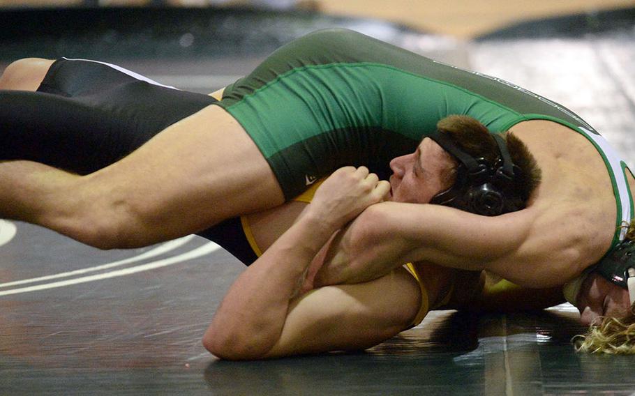 Kubasaki's Colin Nation pins Kadena's Joey Puterbaugh in 30 seconds at 180 pounds during Wednesday's Okinawa wrestling dual meet. The Dragons won 38-24.