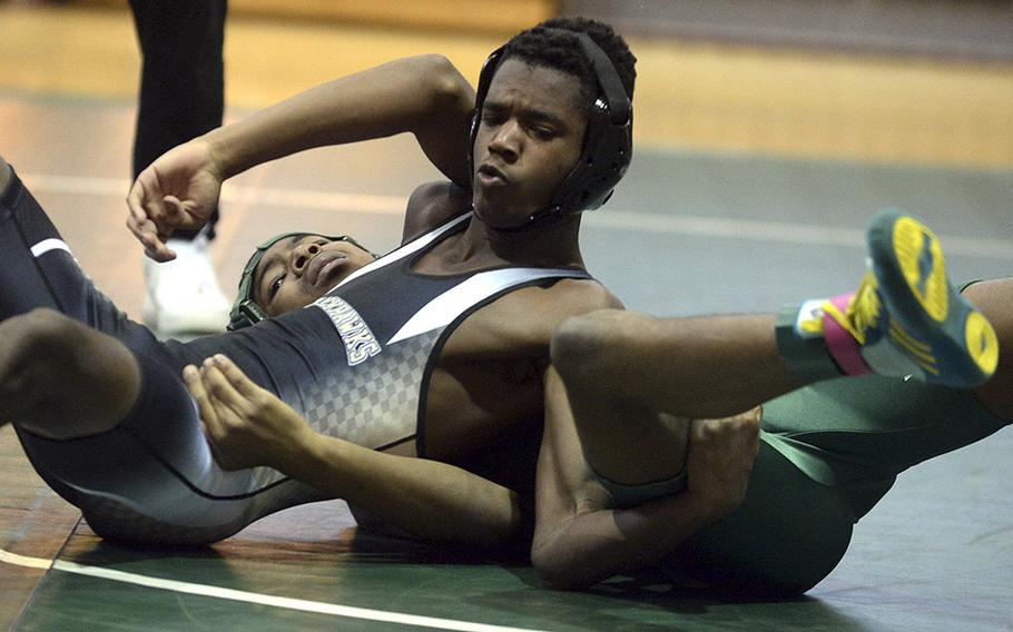 Humphreys' Asher Dunton gets the advantage on Daegu's Javon Pryor at 129 pounds during Saturday's Daegu quad-meet. Dunton won by pin in 30 seconds.