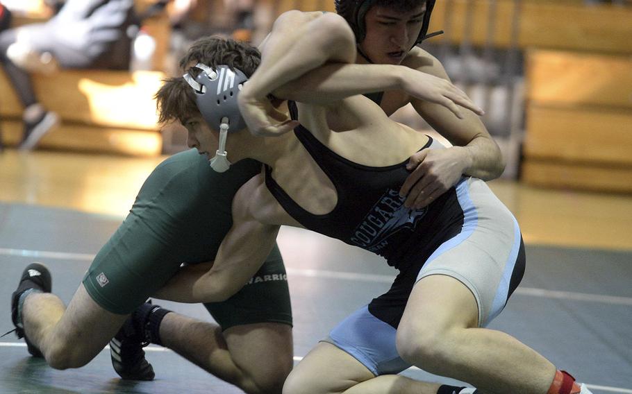 Daegu's Charles Lyons, back, and Osan's Toy Williams tangle at 141 pounds during Saturday's Daegu quad-meet. Williams won by pin in 2 minutes, 59 seconds.