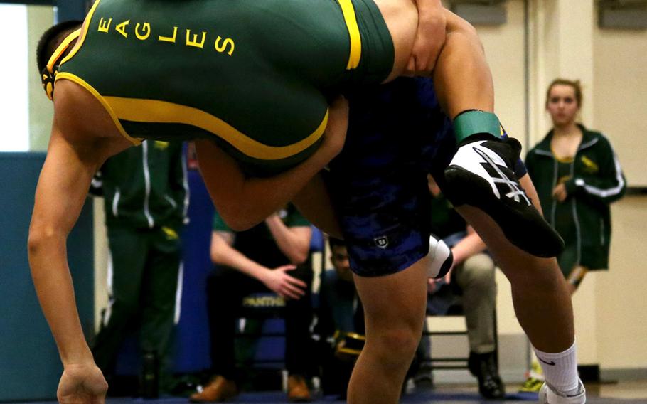 Yokota's Joey DeGrella lifts Robert D. Edgren's Douglass Tackney in the 148-pound semifinal during Saturday's Yokota Invitational. DeGrella would go on to finish second.