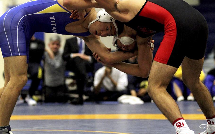 St. Mary's International's Hikaru Shimada, left, and Nile C. Kinnick's Josiah Millare tangle at 141 pounds during Saturday's Yokota Invitational. Shimada would go on to win the title.