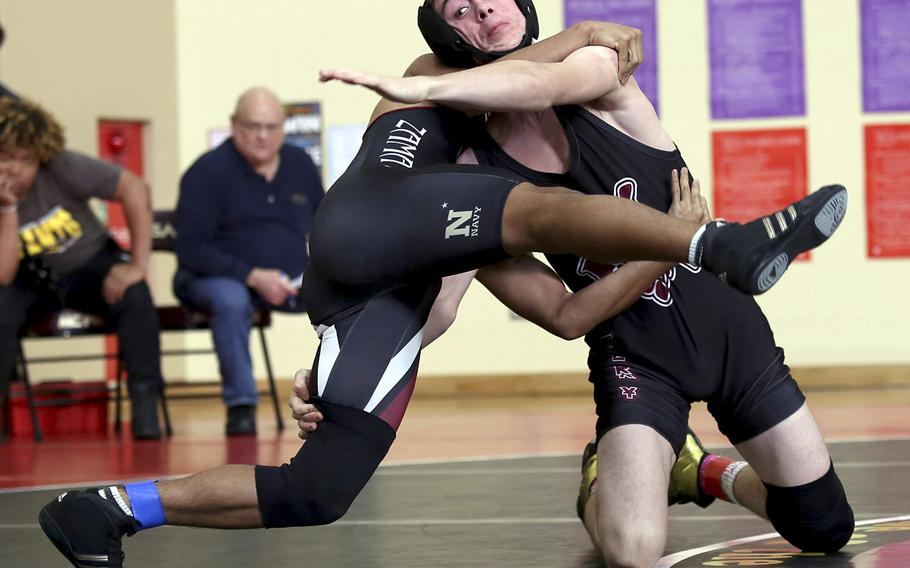 Matthew C. Perry's James Williams scores a technical fall over Zama's Joseph Sanchez at 135 pounds during Saturday's Perry Invitational.