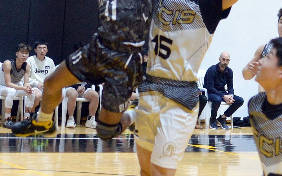 Humphreys' Devyn Lewis drives for a shot against Taejon Christian's Jooha Lee during Wednesday's Korea Blue boys basketball game. The Blackhawks won 78-30.
