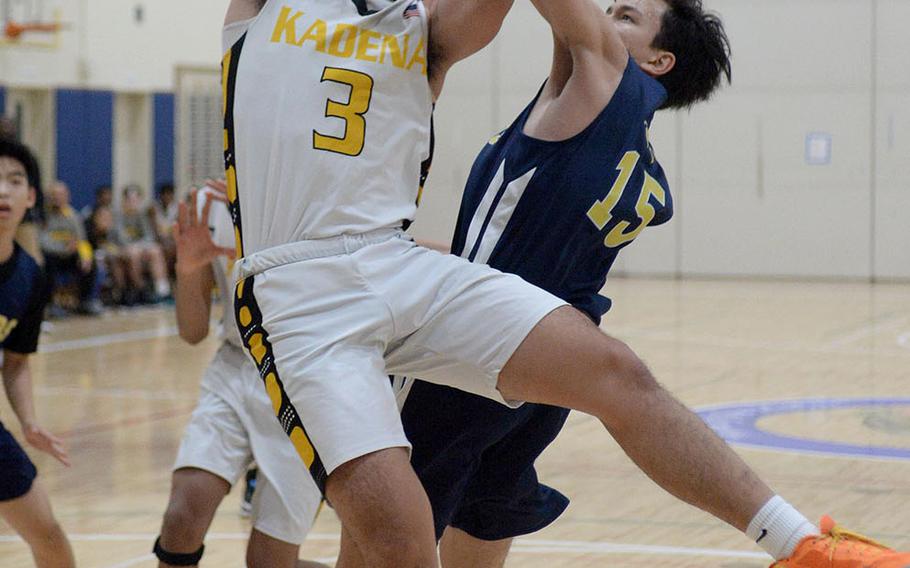 Kadena's Casey Cox leans in for a shot against Taipei American during Saturday's Taipei Basketball Exchange boys game. The Panthers won 86-79 in double overtime.