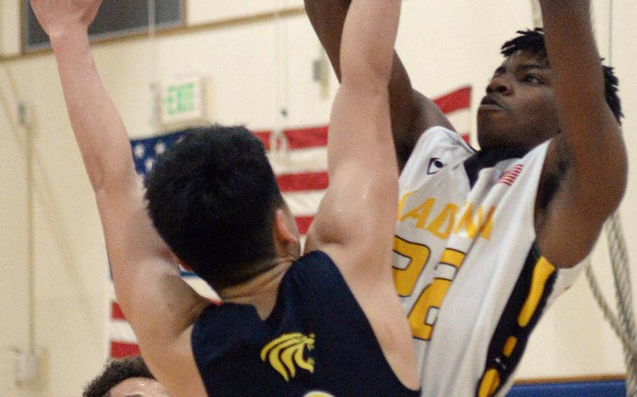 Kadena's John Emery III shoots against Taipei American during Saturday's Taipei Basketball Exchange boys game. The Panthers won 86-79 in double overtime.