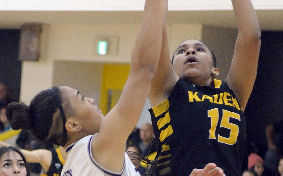 Kadena's Kyleigh Wright shoots against Academy of Our Lady of Guam during Thursday's ASIJ Kanto Classic girls game. The Panthers beat the defending champion Cougars 44-31.