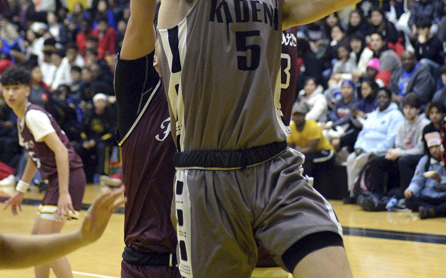 Kadena's Blake Dearborn shoots against Father Duenas during Saturday's boys varsity basketball finals game. Father Duenas won the game and the tournament championship.