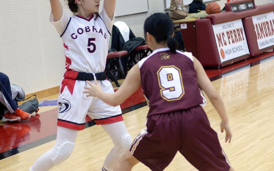 E.J. King's Ellen May looks to pass against Noda Gakuin during Friday's Japan girls basketball game. Noda Gakuin won 57-32.