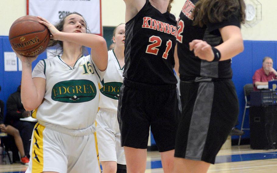 Robert D. Edgren's Destiny Jagers finds herself bottled up by Nile C. Kinnick's Cassi Boyer and Madelyn Gallo during Friday's DODEA-Japan girls semifinal, won by the Red Devils 47-18.