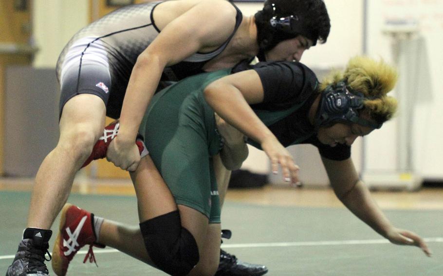 Humphreys' Michael Hudak gains control over Daegu's Albony Pryor en route to a pinfall victory at 158 pounds during Saturday's Korea wrestling tri-meet at Daegu. The Blackhawks downed the Warriors 50-10.